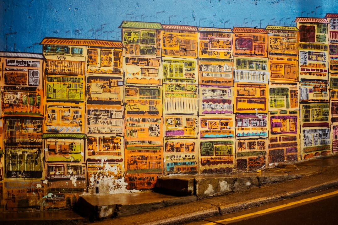 Colourful vintage advertising posters on a street wall